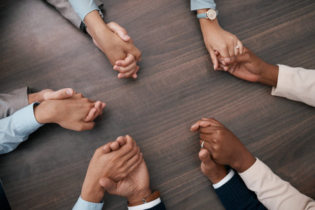 Teamwork, collaboration and business people holding hands before meeting in the office. Diversity,...