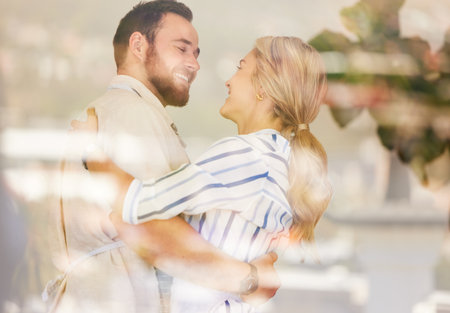 Happy caucasian couple dancing at home. Smiling husband and wife celebrating anniversary, enjoying tender moment. lovers bondingの写真素材