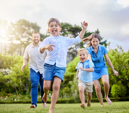 Were only getting stronger. a young family spending a day at the park.の写真素材