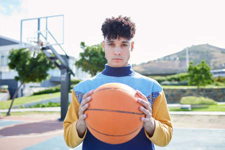 Basketball, sports and man training for game on an outdoor court in summer. Portrait of a professional athlete with motivation playing cardio sport and fitness with a ball for competition or eventの写真素材