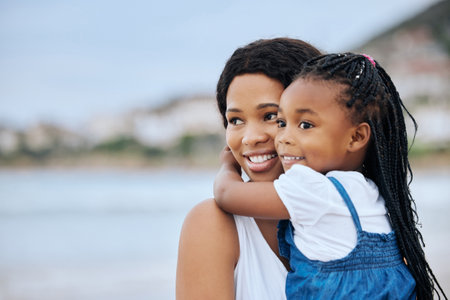 Baby girl, this should all be yours. a mother and daughter bonding at the beach.の写真素材