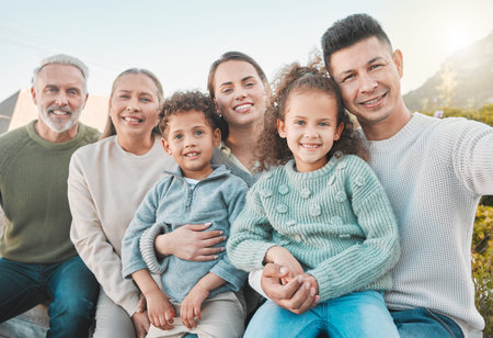 A family creates a safe space for each member. a multi-generational family posing together outdoors.