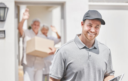 Another satisfied customer. Cropped portrait of a handsome young male courier leaving his customers...