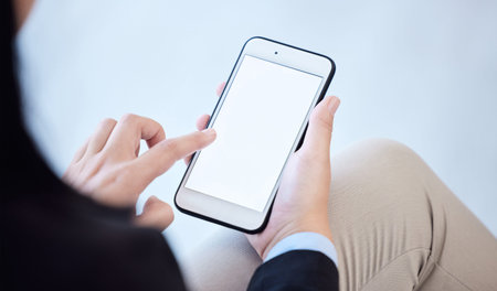 Either you run the day or the day runs you. an unrecognizable businesswoman using a smartphone in a...