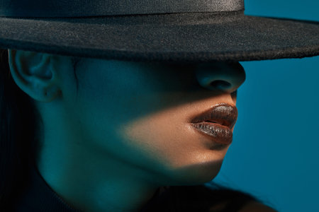 Be fashion forward. Conceptual shot of a stylish young woman posing in studio against a blue...