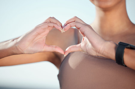 I love the way healthy feels. Closeup shot of an unrecognisable woman making a heart shape with her...