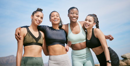 Feeling light as a feather. a group of friends taking a break during a workout.の写真素材