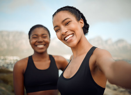 My friends are my life. two friends taking selfies during a workout.の写真素材