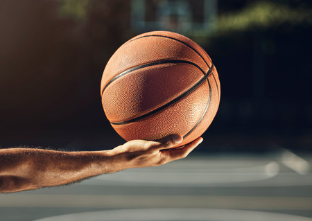 Sport, hand and basketball training at basketball court with man holding ball before practice....