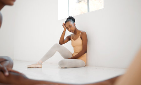 You say youre depressed all I see is resilience. Studio shot of a young ballet dancer having a stressful day in a dance studio.の写真素材