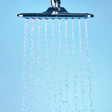 For those days the sun wont touch your face. an empty running shower against a blue background.の写真素材