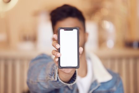 This is all that I want. a man holding up his smartphone.