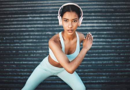 Fitness portrait of black woman with music headphones for exercise, sports training or body workout...