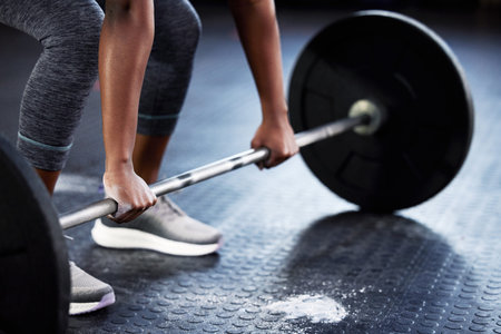 Never let excuses get in the way of a killer workout. an unrecognizable woman working out with a...