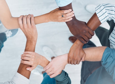 Wrist hands, team building and business people support diversity, group and collaboration, cooperation and community mission. Above solidarity, partnership and motivation of goals, trust and teamworkの写真素材
