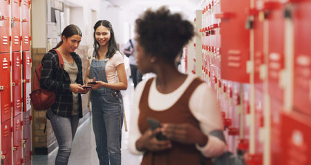 If they only knew what life was like for me. a teenage girl using a smartphone next to her locker...