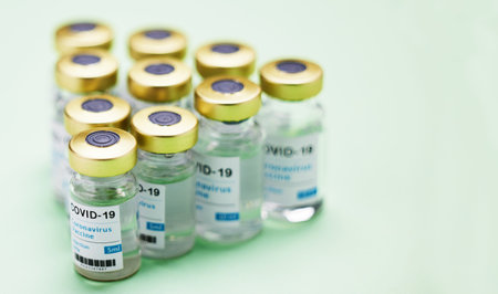 This is all it takes to save a life. Studio shot of vaccine tubes against a green background.