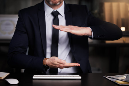 Theres a lot you can do with this. an unrecognisable businessman showing copyspace while sitting at his desk.の写真素材