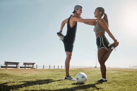 Soccer fitness, couple and stretching at the beach park for workout, exercise and training together...