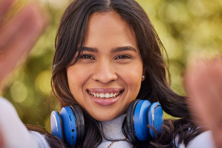 Selfie portrait of young Indian woman, happy outdoor freedom and weekend lifestyle in Indonesia. Gen...