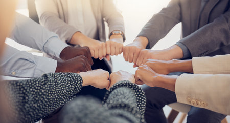 Team building, diversity and circle teamwork, motivation and inspiration, mission goals and company about us. Closeup business people fist hands, support and trust, global community and collaborationの写真素材