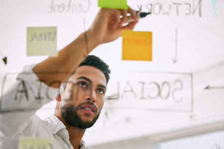 Focused and ready to get working. businesspeople having a meeting in a boardroom at work.の写真素材