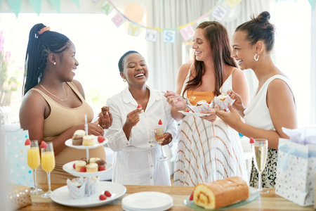 The best part of being pregnant. a group of women eating dessert while celebrating at a friends baby...