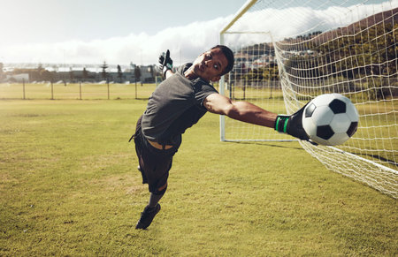 Soccer, sports and goalkeeper training on a field for a professional competition. Young and strong...