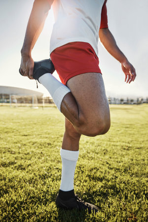 Exercise, man and athlete doing stretching, prepare for training and practice for soccer game with...