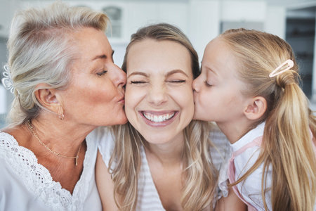 Kiss, child and grandmother with love for mother on mothers day in the living room of their house....
