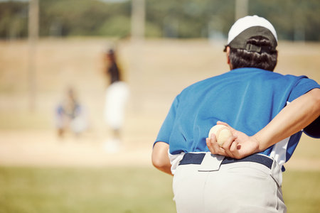 Sports, baseball pitch and pitcher with ball, ready to throw to player with bat. Fitness, exercise and athlete focus on baseball field for training, practice or softball game and determination to winの写真素材
