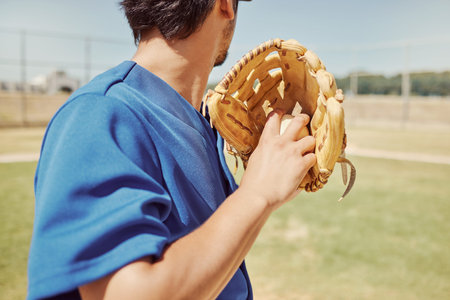 Baseball, sports and man pitching during a game, training and professional event on a field. Back of...