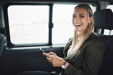Woman, road trip and phone for location, gps and map of summer vacation holiday direction. Portrait, smile or happy tourist in car for adventure travel with 5g mobile technology for fun internet gameの写真素材
