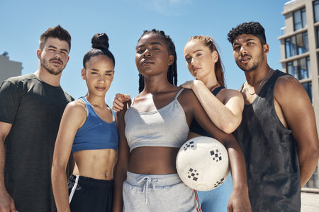 Volleyball, sports and portrait of a team of friends standing on an outdoor court with a ball for game. Diversity, fitness and people ready for sport match together for exercise, workout or training.の写真素材