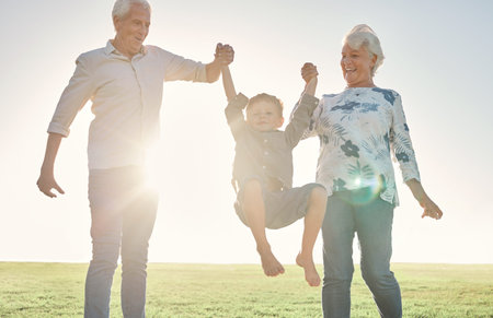 Family, holding hands and grandparents with boy in park, nature or outdoors. Love, support and happy...