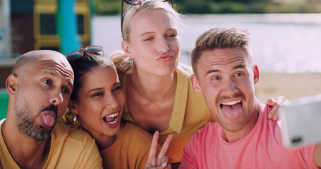 Saturdays are for making memories with friends. a group of friends taking photos outside using a...