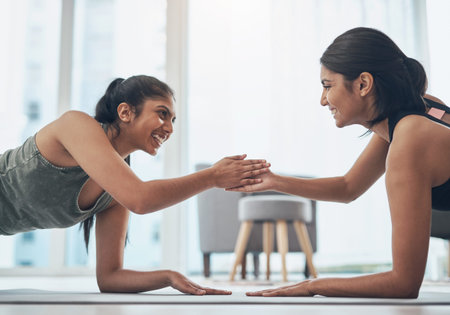 Are you up for a fitness challenge. two beautiful young women exercising together at home.