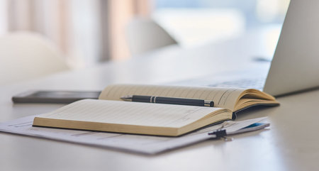 Put your ideas to paper. Closeup shot of a laptop and notebook on a desk in an office.
