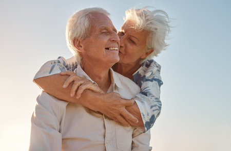 Kiss, hug and senior couple with love, care and happiness in their marriage together in nature....