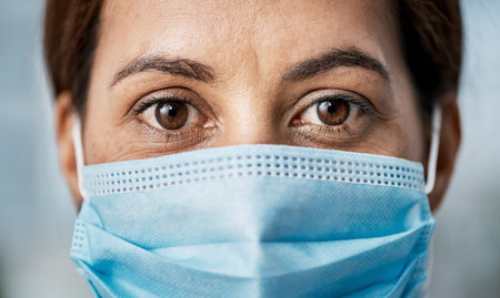 The end of the pandemic will be an evolution, not a revolution. Portrait of a woman wearing a face...