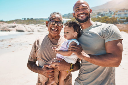 Baby, beach and family with a father, grandfather and son on the sand during a summer vacation...