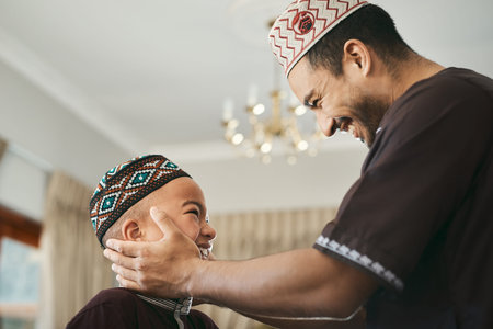 I will always love you. a muslim father gazing affectionately at his son.