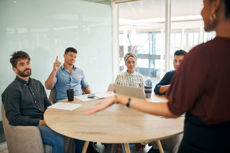 I have something to share. a group of businessman raising his hand during a presentation in an...