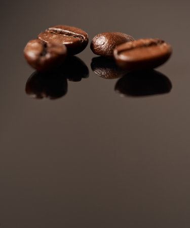 Coffee is everyones best friend. Studio shot of coffee beans against a brown background.の写真素材