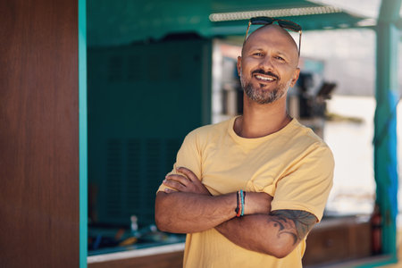 We made a lot of profit today. Portrait of a cheerful middle aged man smiling brightly while...