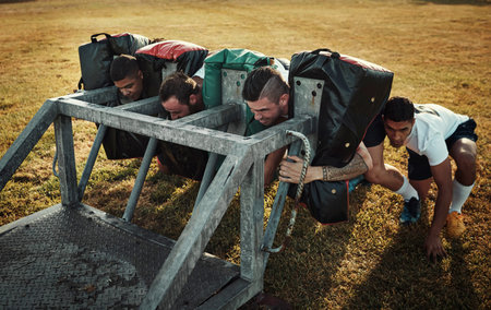 This is how champions become champions. Full length shot of a group of young rugby players training...