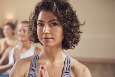 Aligning my chakras. Cropped portrait of a young group of women sitting together and meditating...