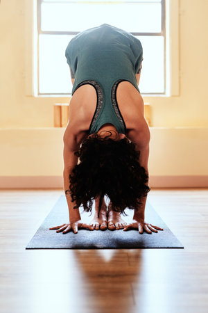 Every workout brings progress. a young woman practicing yoga.
