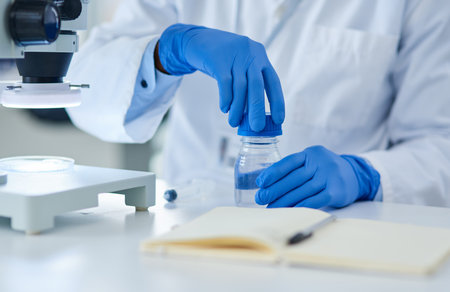 Why isnt this closed properly. Closeup of an unrecognizable scientist closing the lid on top of a...