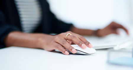 Shes hands on when it comes to her business. Portrait of an attractive young businesswoman working and writing down notes in her journal at work.の写真素材